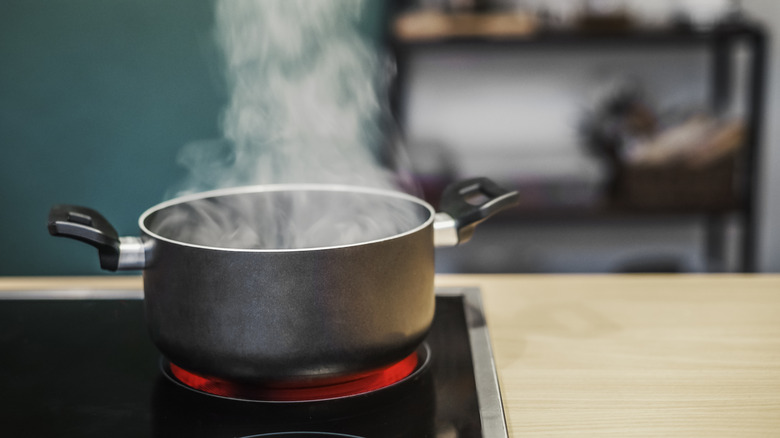 A pot with steam flowing out of it