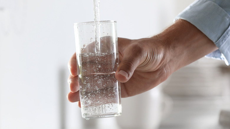Filling a glass of water 