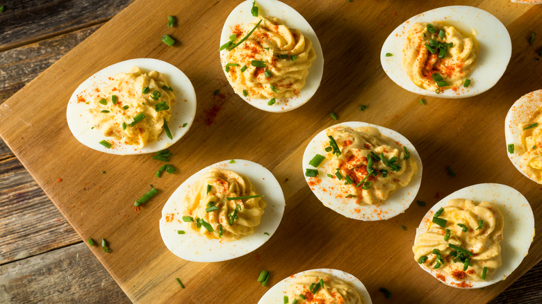 Deviled eggs on wooden tray