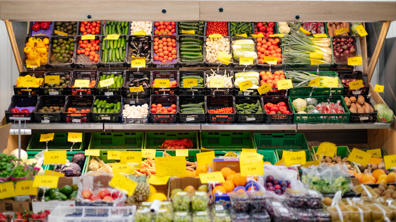 A produce department at a grocery store showing a variety of fruits and vegetables