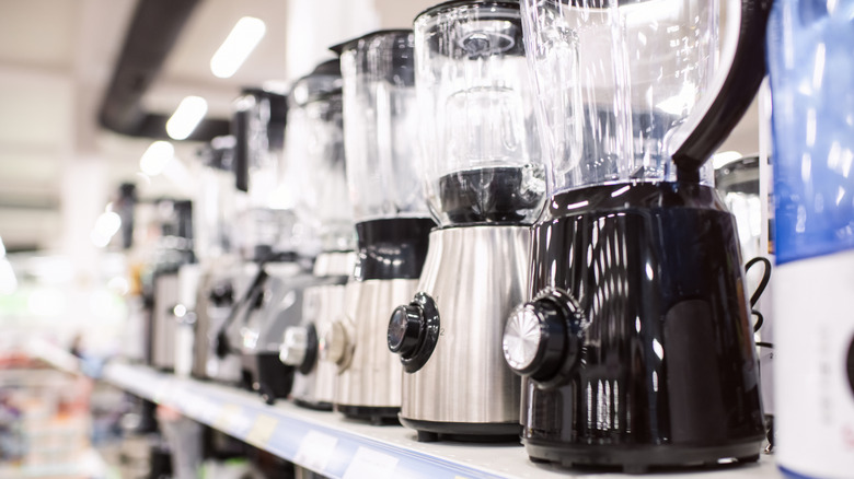 Variety of blenders on a store shelf