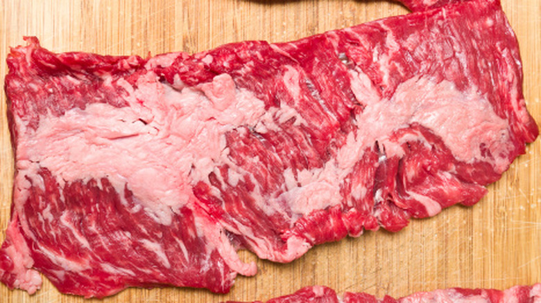 Skirt steak on wooden cutting board