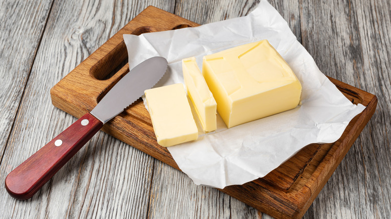 Sliced butter on a cutting board