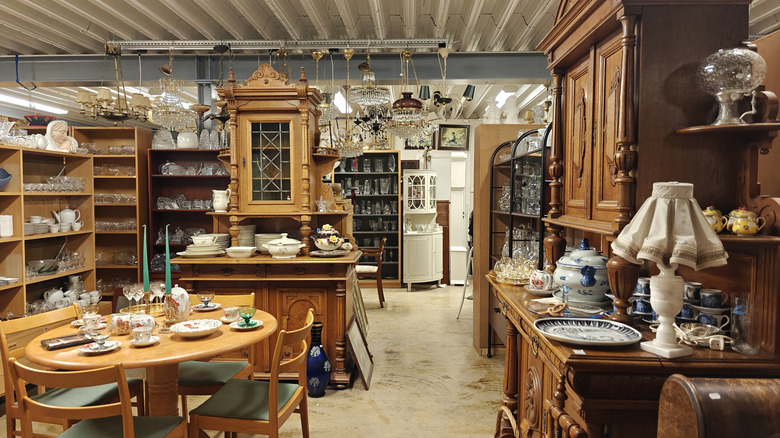 Interior of an antiques shop with cabinetry and dishware