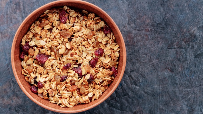 Granola, dried fruits in bowl