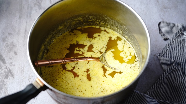 making clarified butter in a pot