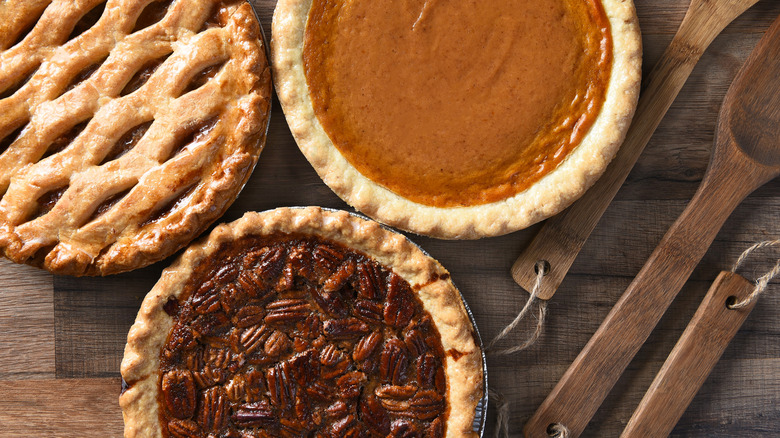 An assortment of apple, pecan, and pumpkin pies