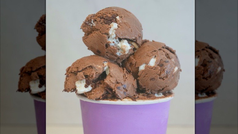 Chocolate ice cream with nuts, chocolate pieces and marshmallow swirl