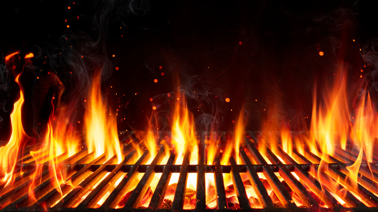 Charcoal on fire on grill