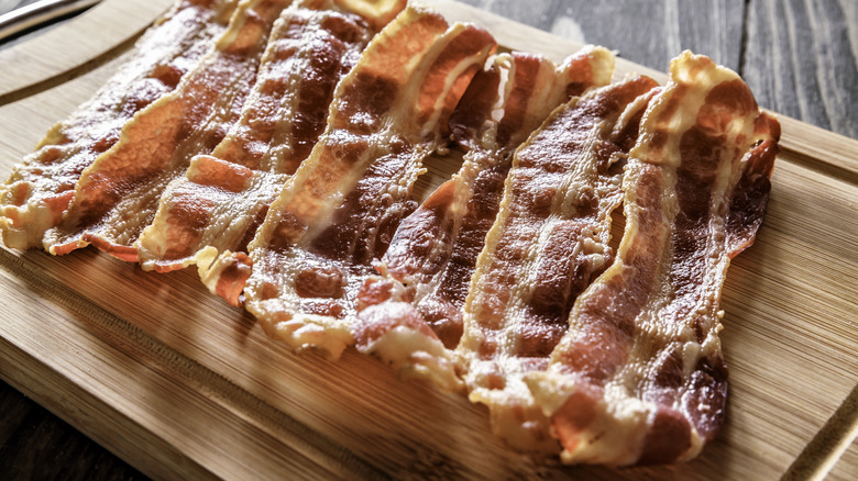 bacon on wooden slab
