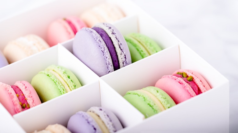 Colorful macarons in white box