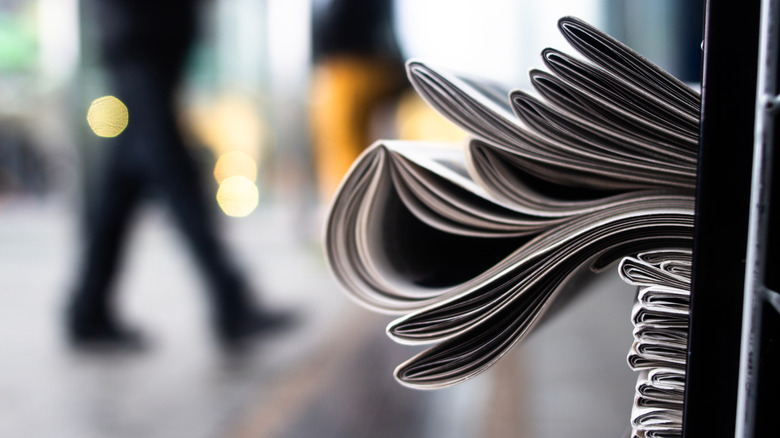 newspapers on a rack
