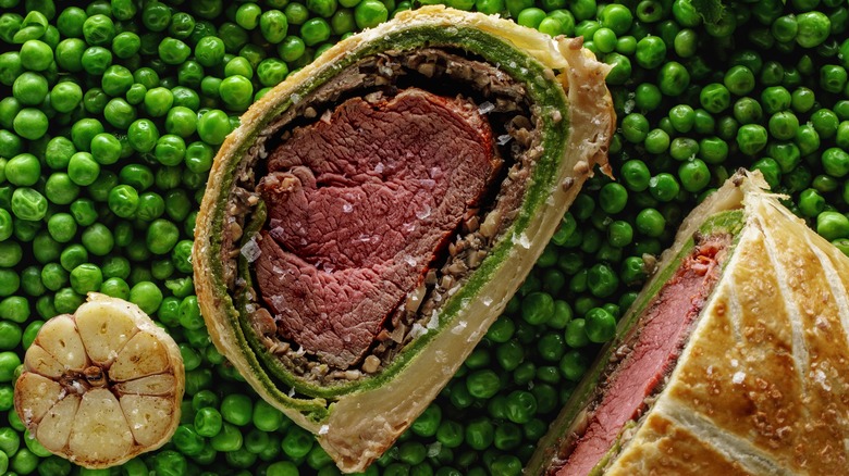 Slice of beef Wellington on peas