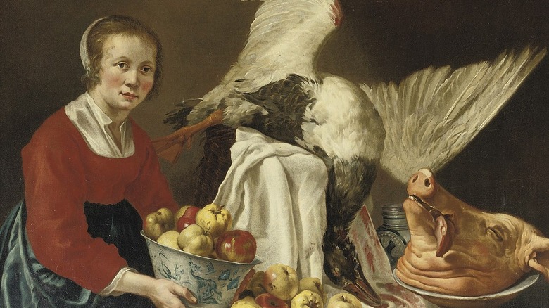 pigs head, bowl of apples