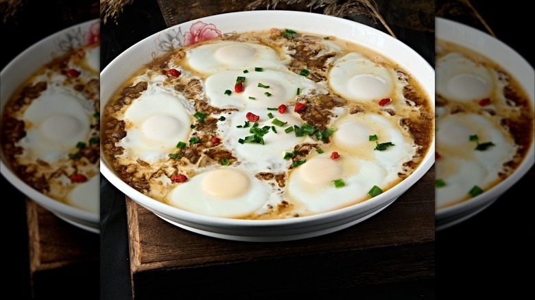 Poached eggs in brothy soup