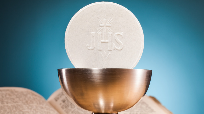 communion wafer in goblet  