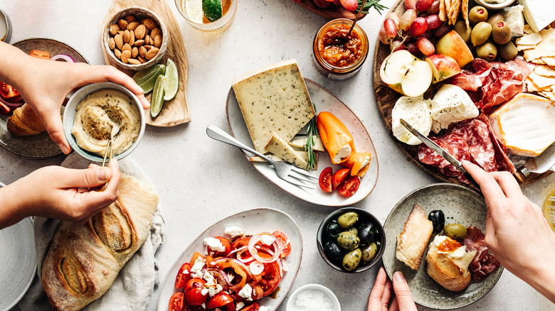 people enjoying a mediterranean platter