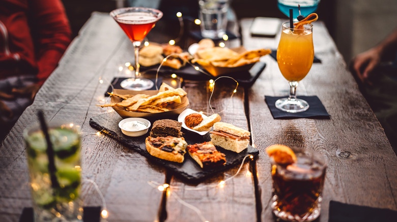 Cocktails and snacks on table