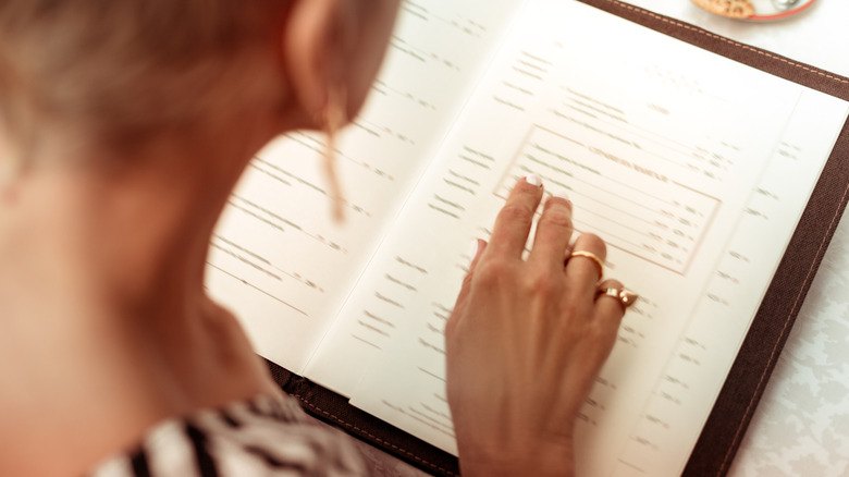 Person looking at restaurant menu