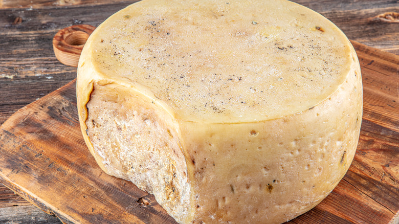 Gruyère cheese on a wooden board