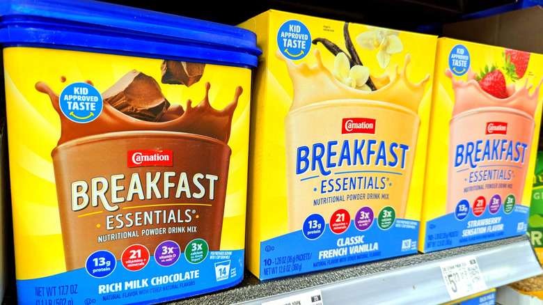 Shelf with three flavors of carnation breakfast essentials