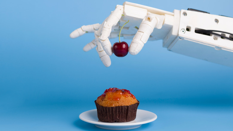 robot arm and cupcake