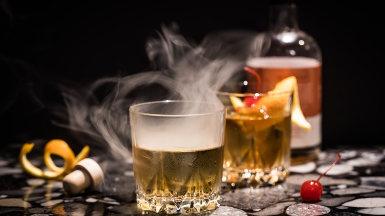 Smoky cocktail on table