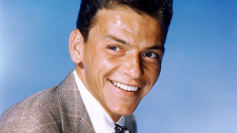 Frank Sinatra turning his head and smiling