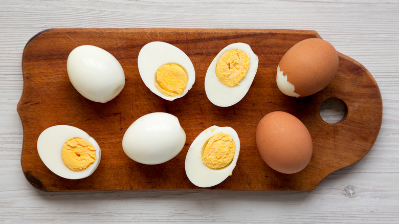 Hardboiled eggs on cutting board