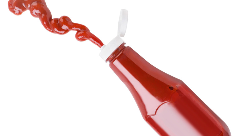 Ketchup being squeezed out of a bottle