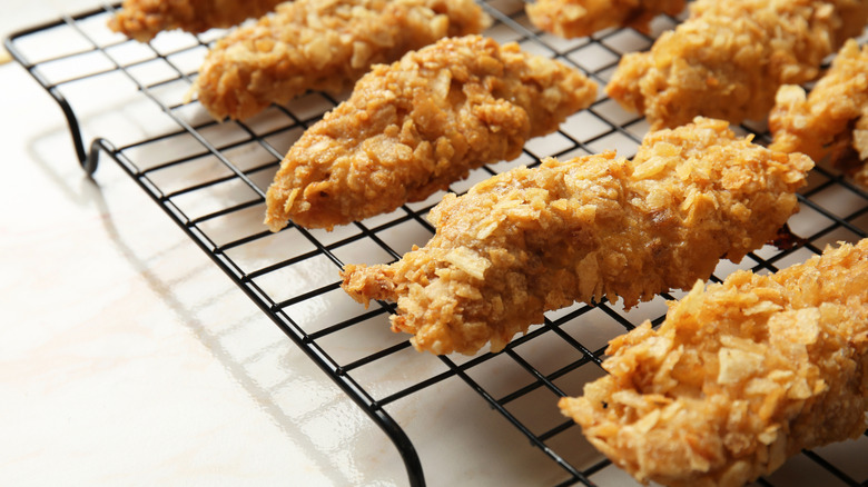 Breaded chicken on cooling rack
