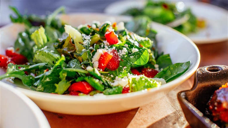 Fresh green salad with strawberries