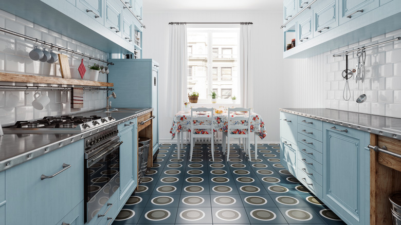 Geometric flooring design in a blue kitchen