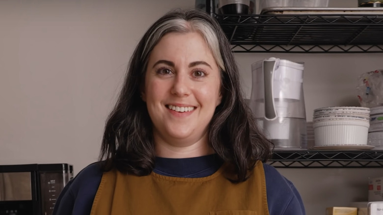 Claire Saffitz in a kitchen smiling