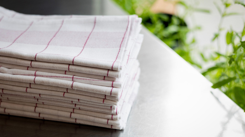 A stack of kitchen towels folded uniformly