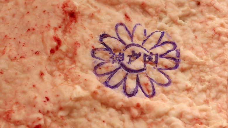 Close-up of the Nojikiku stamp on Kobe meat