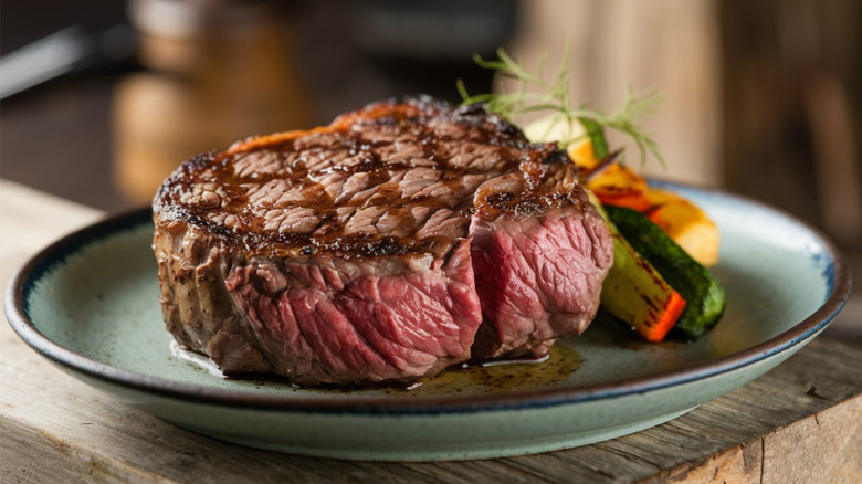 A medium rare steak with a well-developed brown crust