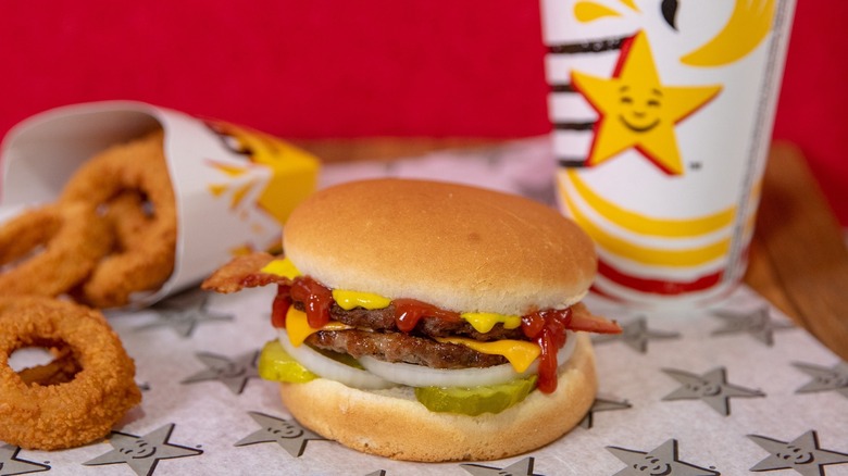 Carl's Jr. cheeseburger, onion rings and drink