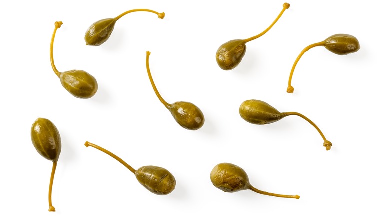 Caperberries on a white background