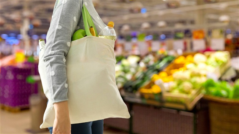 Women with bag at grocery store