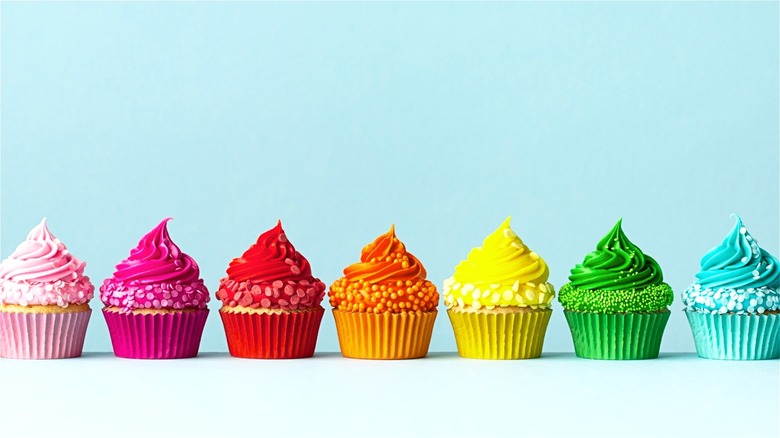 Rainbow cupcakes in a row