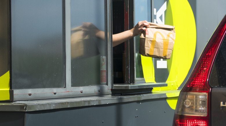 A car going through the McDonald's drive thru