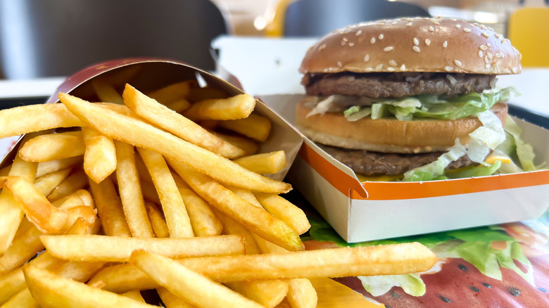 A Big Mac in open box and fries