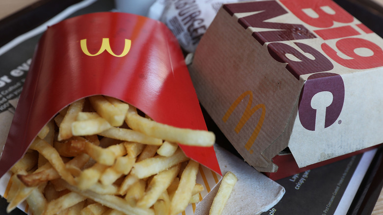 french fries next to big mac box on tray