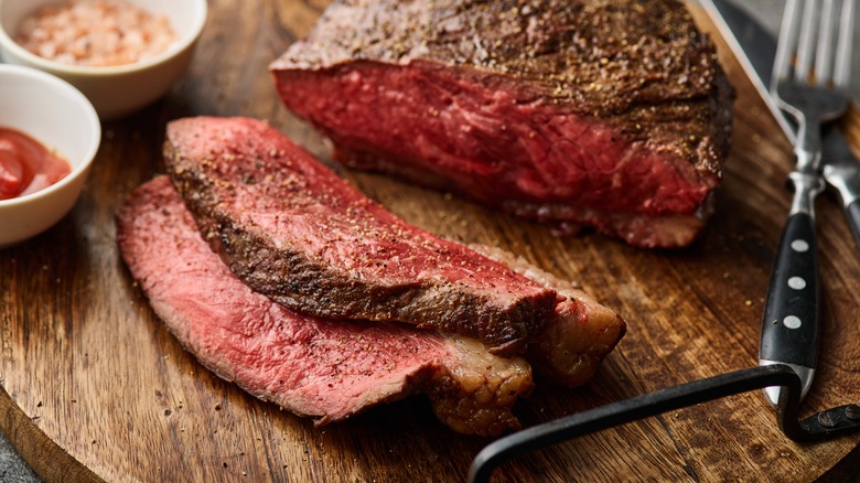 sliced steak on a cutting board