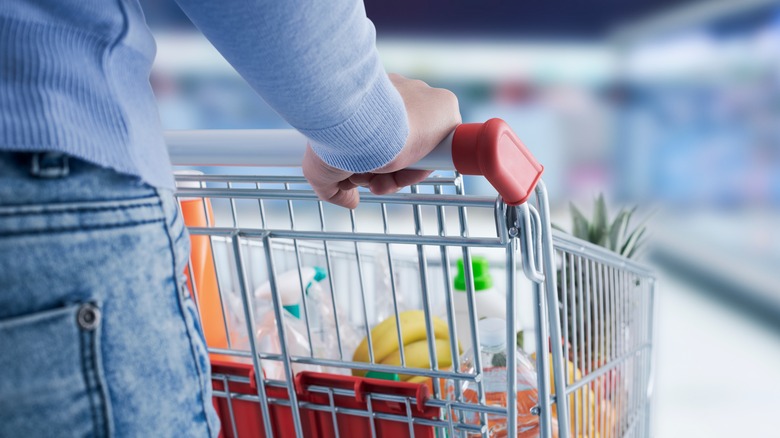Woman pushing shopping cart