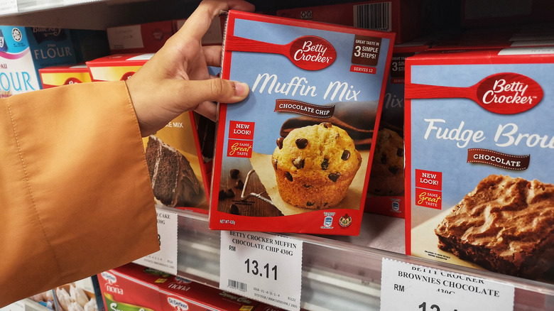 Person holding muffin mix