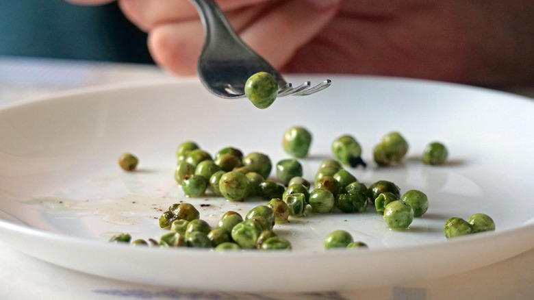 Pea on the tines of a fork
