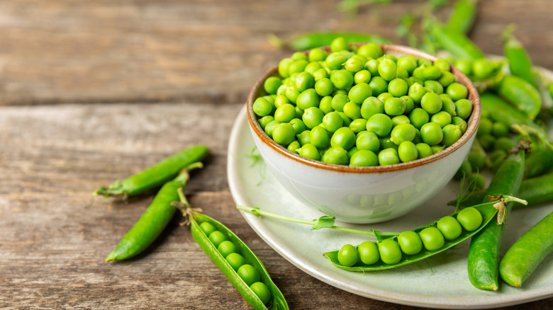 Bowl of fresh peas and pods