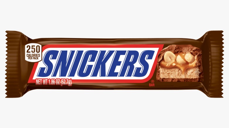 A close-up of a Snickers bar isolated on a white background